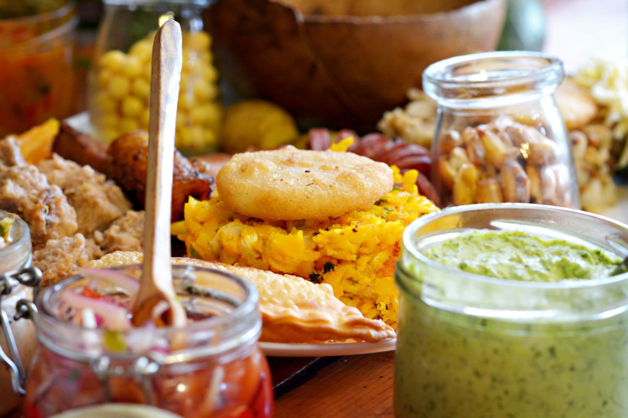 A vibrant display of Ecuadorian dishes featuring plantains and sauces, perfect for cultural food lovers.